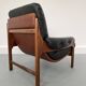Fauteuil en teck et cuir années 1960
