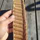 Vintage wall-mounted wicker and pyrographed wood bread basket