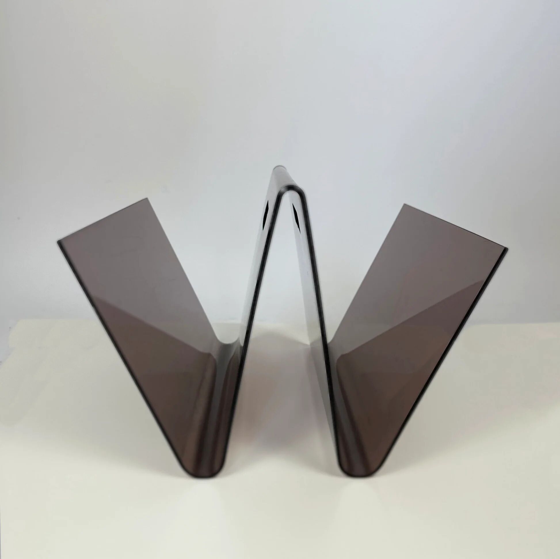 Smoked plexiglass magazine rack in the shape of a W — 1970s