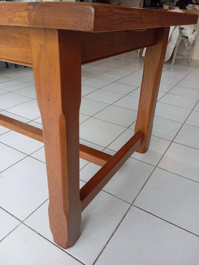 Large rectangular dining table in solid oak in a neo-rustic style.