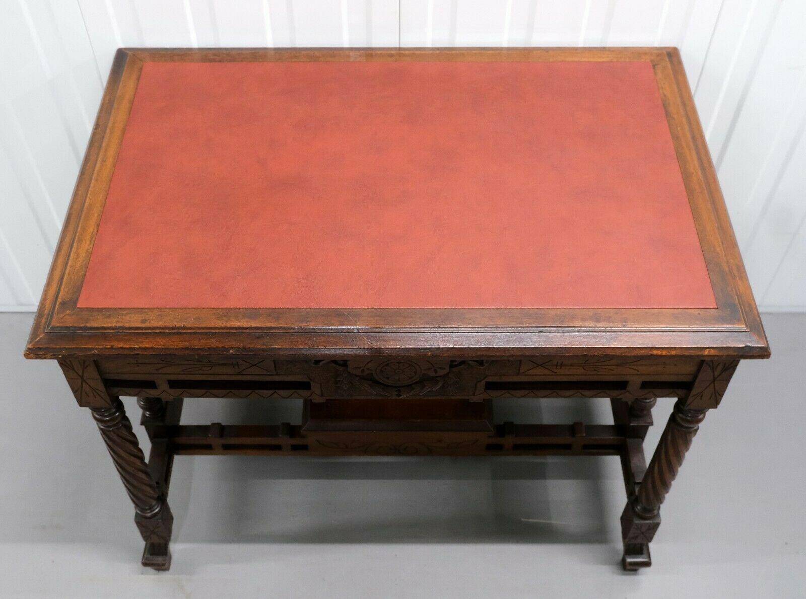 19th-century carved walnut desk with a leather top.