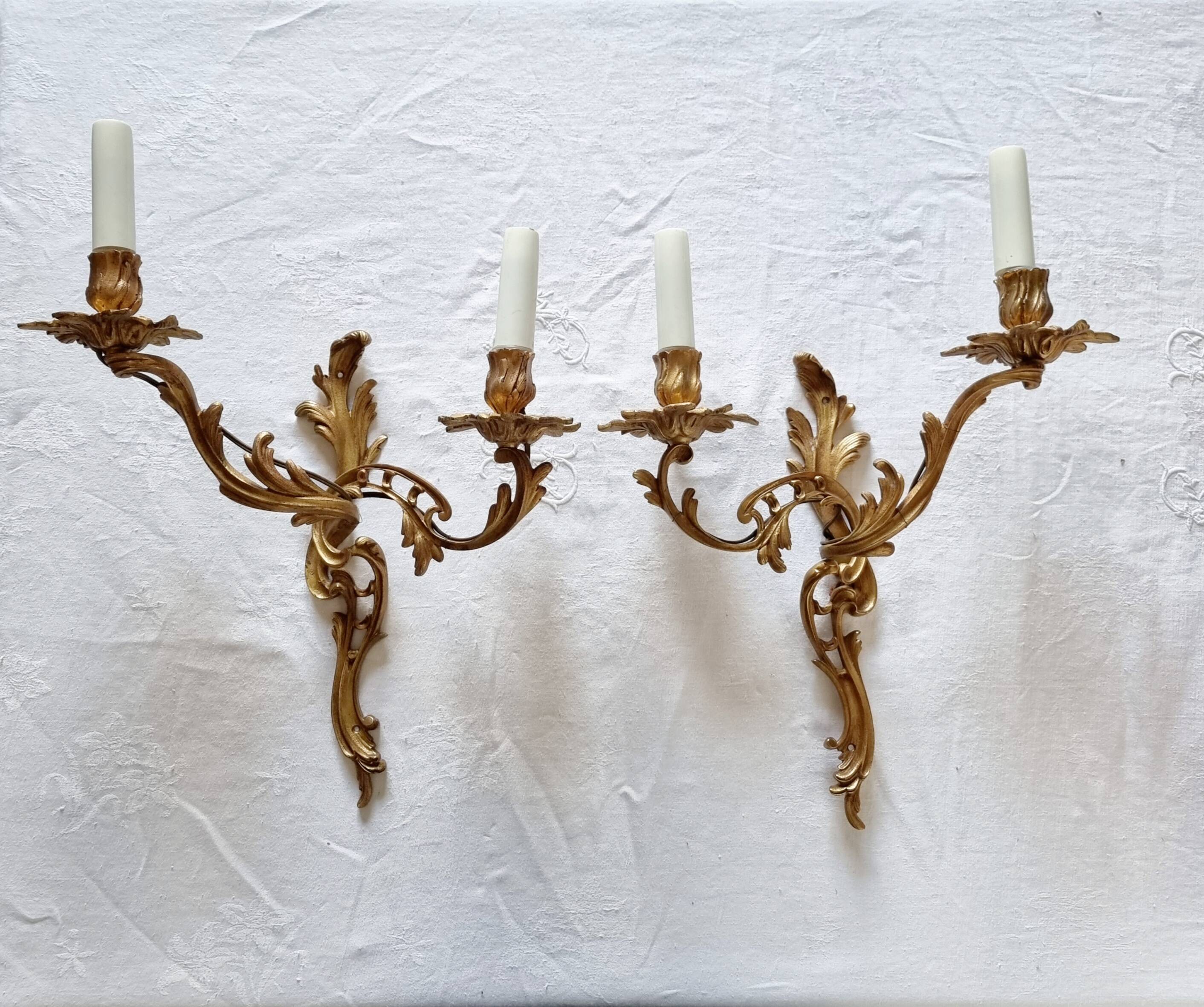 Pair of vintage French wall sconces in bronze, Louis XV Rococo style.