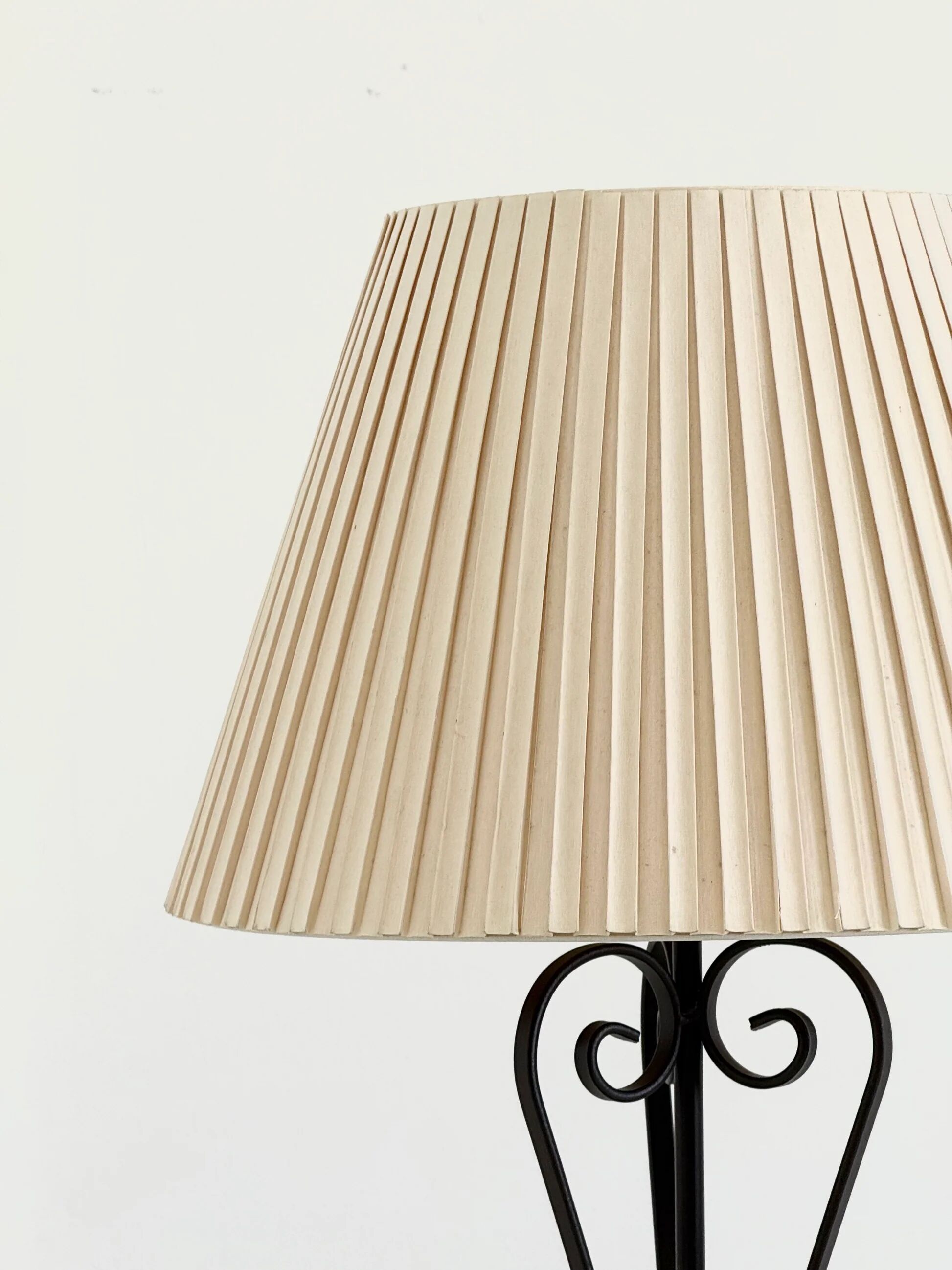 Vintage wrought iron table lamp in swirl shape with pleated shade
