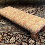 Long rustic footrest on ball feet