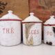 Series of 6 spice pots in white and red enamel for cooking