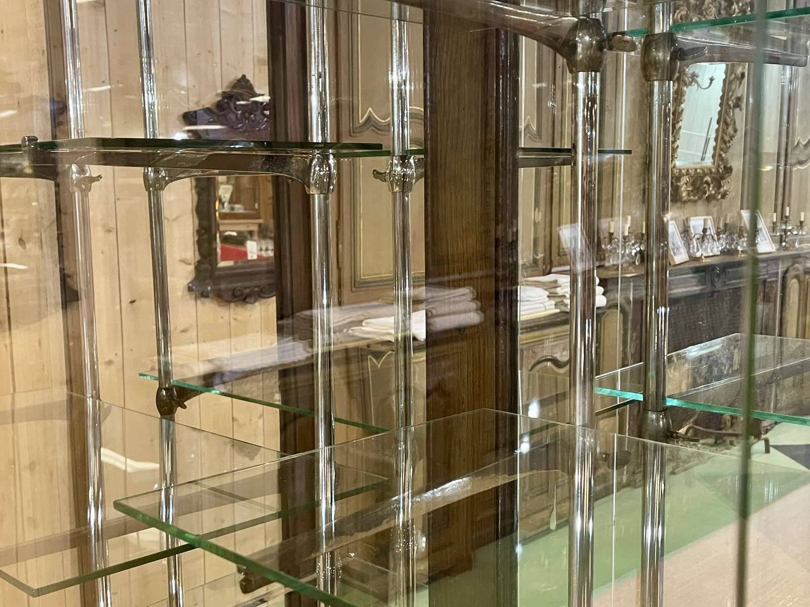 Early 20th-century shop display cabinet in oak with sliding doors.