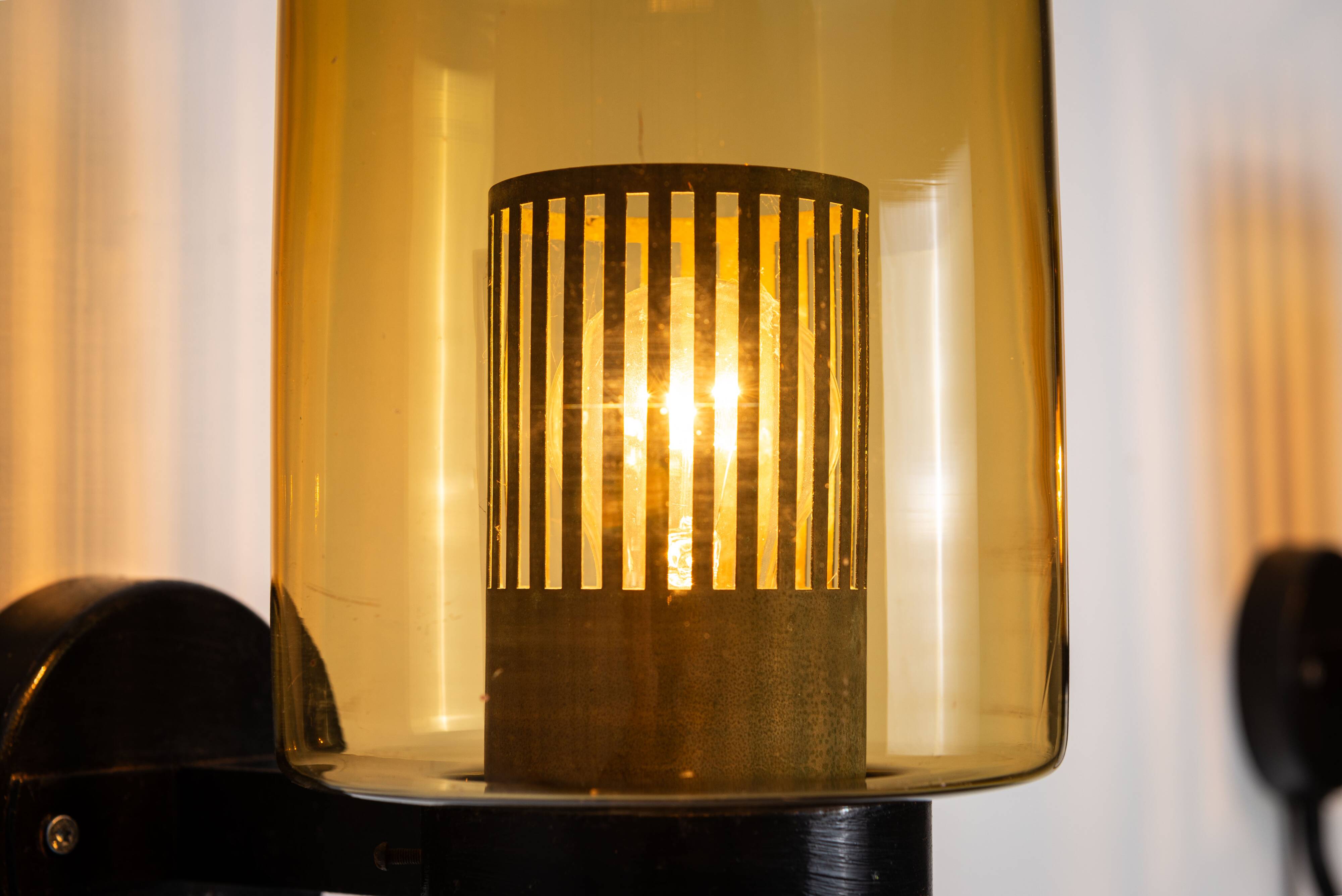 Pair of black metal wall lamps with yellow shades and inner diffuser