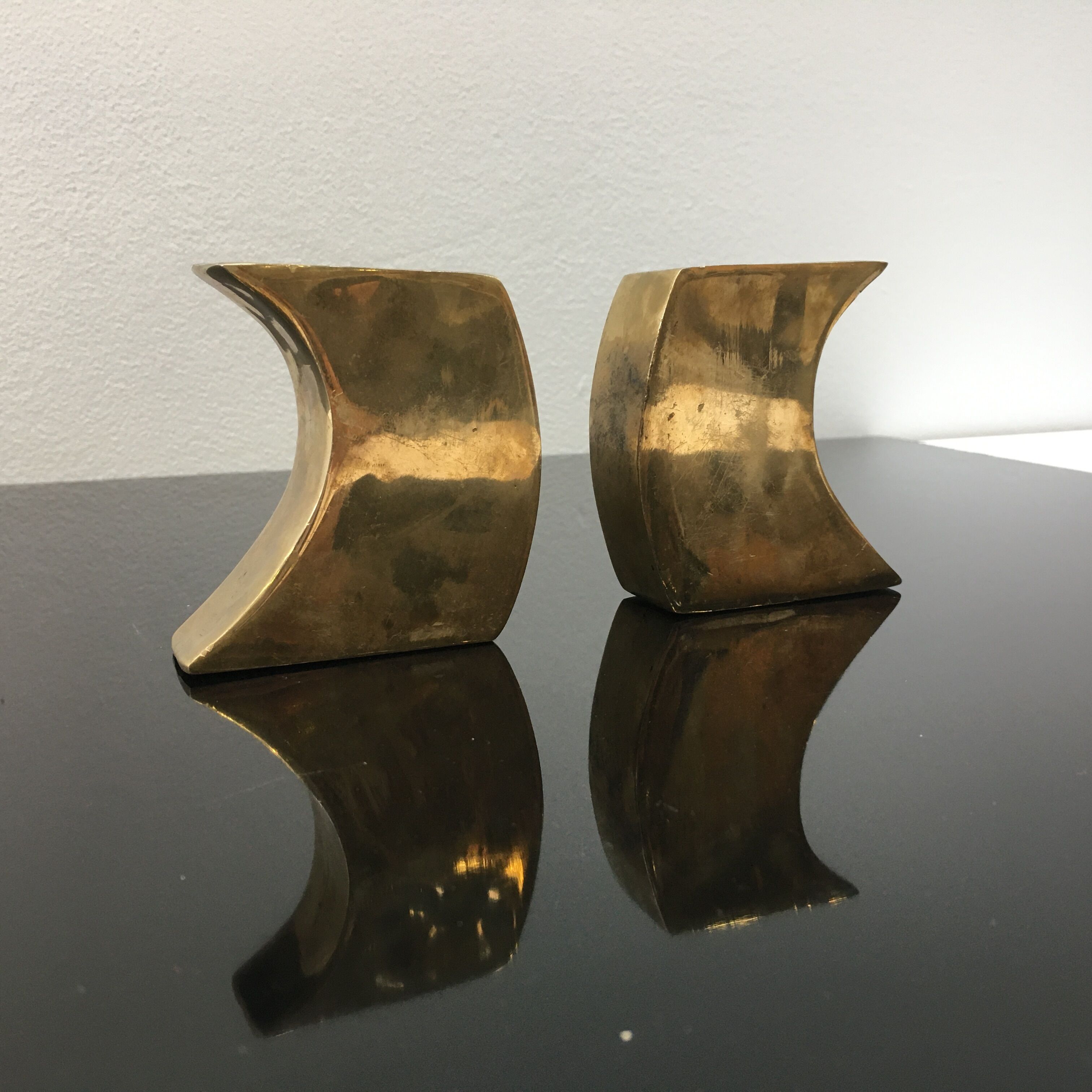 Pair of bronze candle holders by Monique Gerber