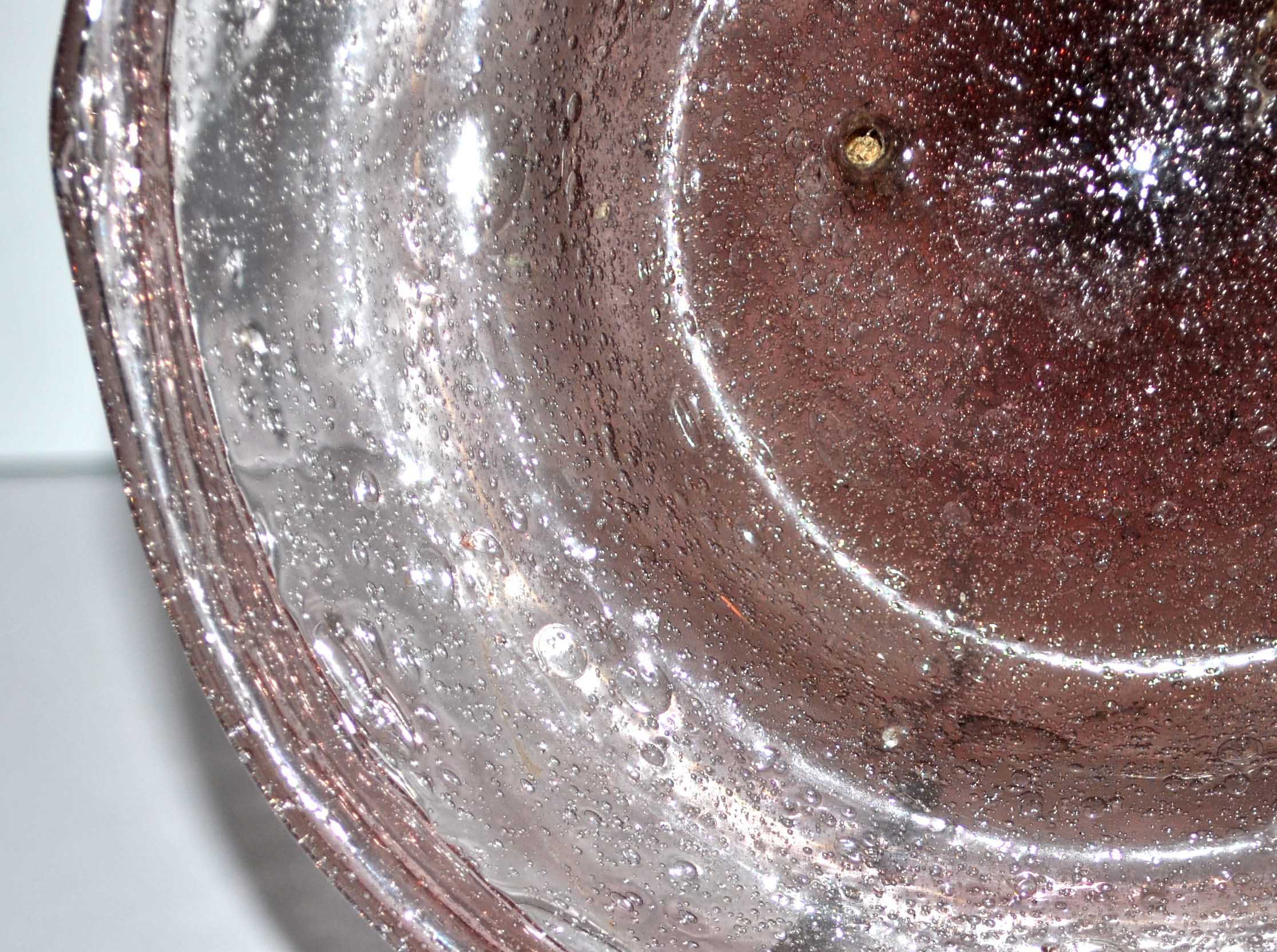 Antique plate in pink bubbled blown glass