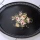 Old black oval top. Bouquet of roses. Hand painted.