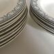 Set de 9 et 6 assiettes en faïence terre de fer de Salins début 20e décor gris vert