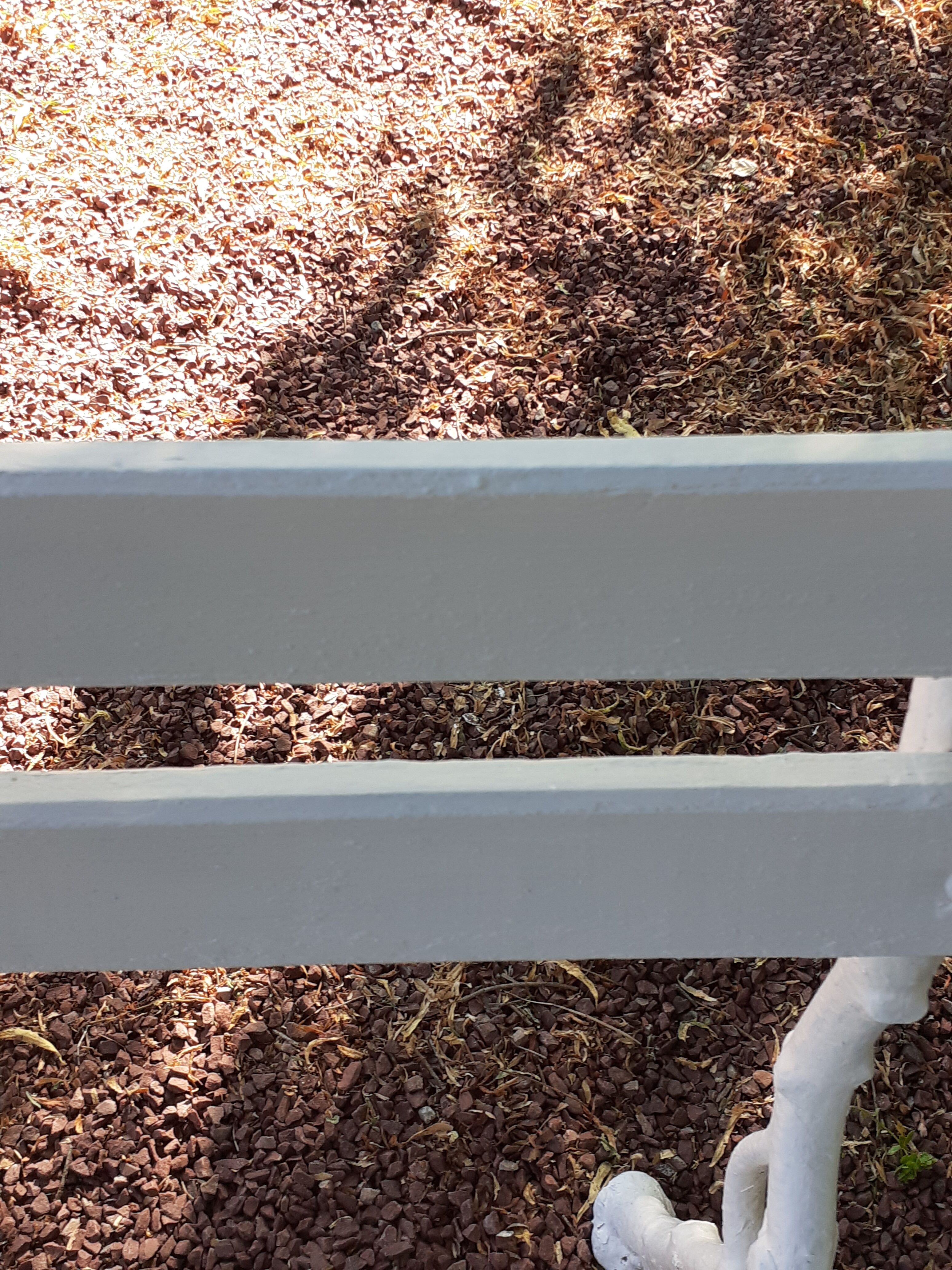 Old garden bench with cast iron feet and wooden planks