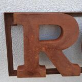 Rock rusty metal sign