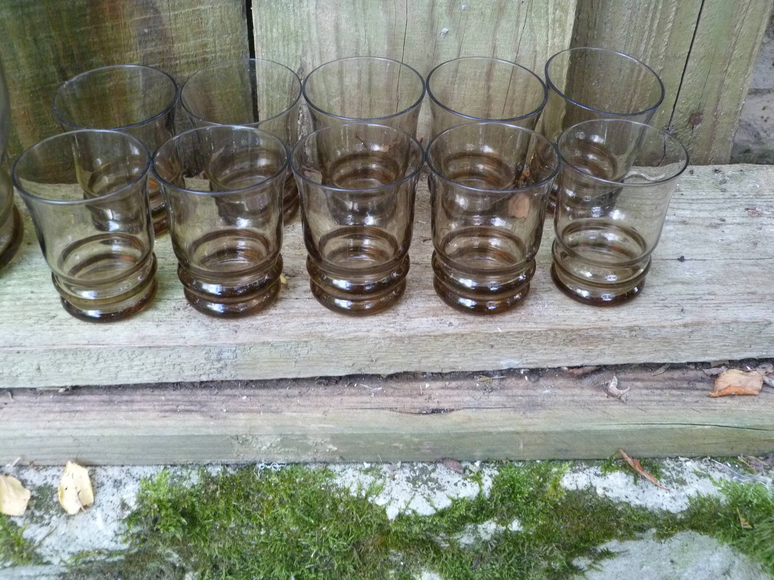 Set of 10 brown glasses and a carafe made in Belgium