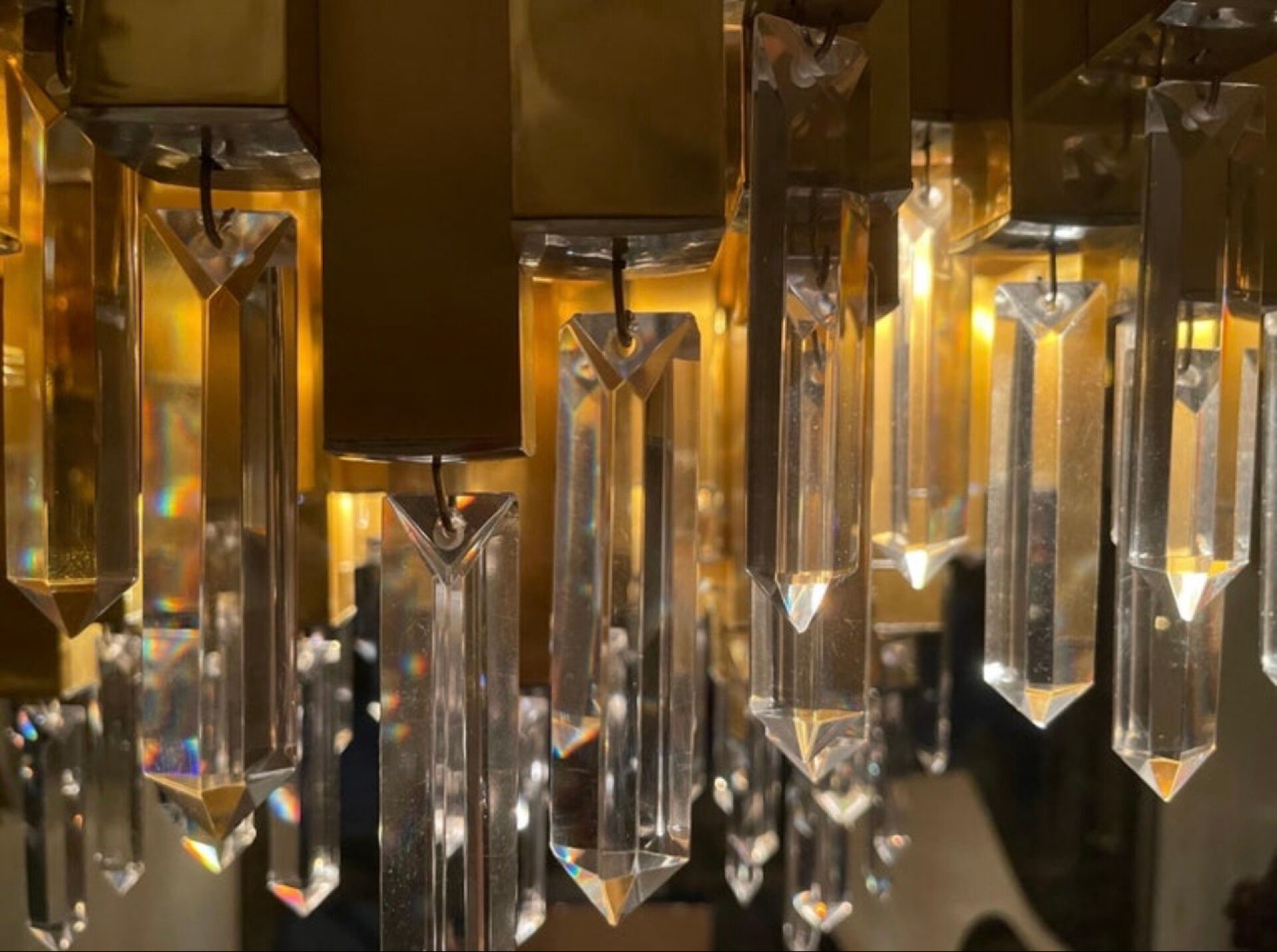 Rare 1970s Lumica chandelier in brass and crystal.