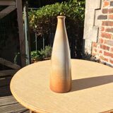 Bottle in sandstone or doilies