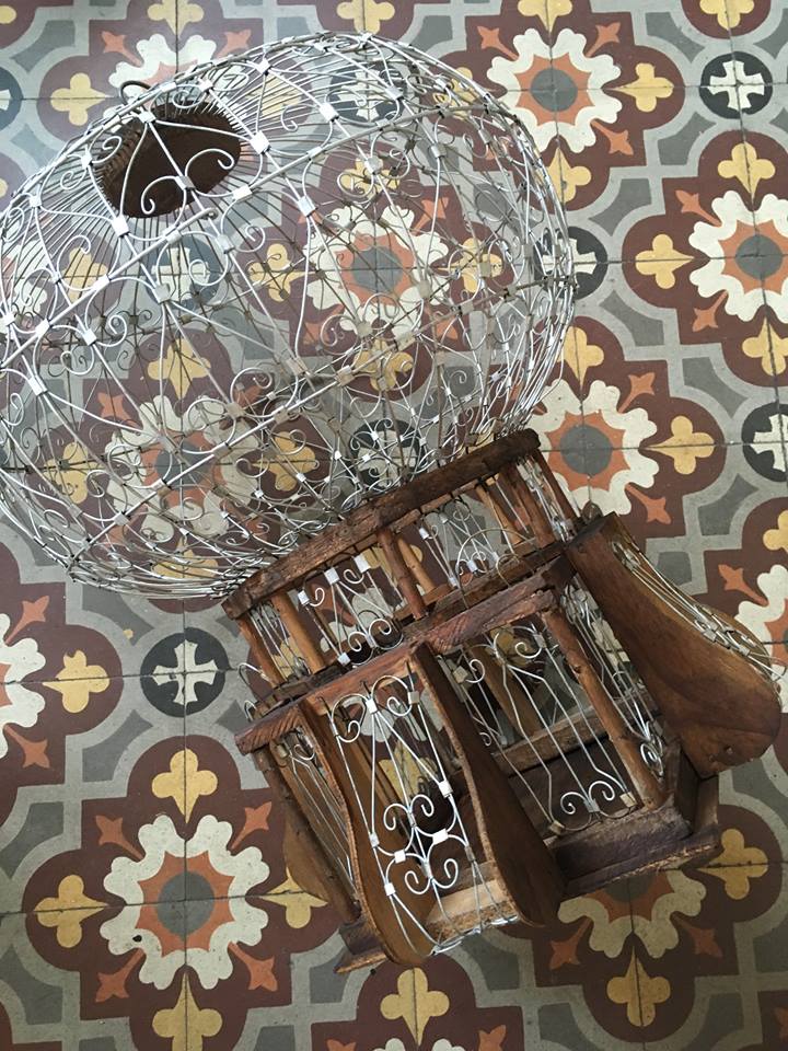 Decorative bird cage of iron and wood