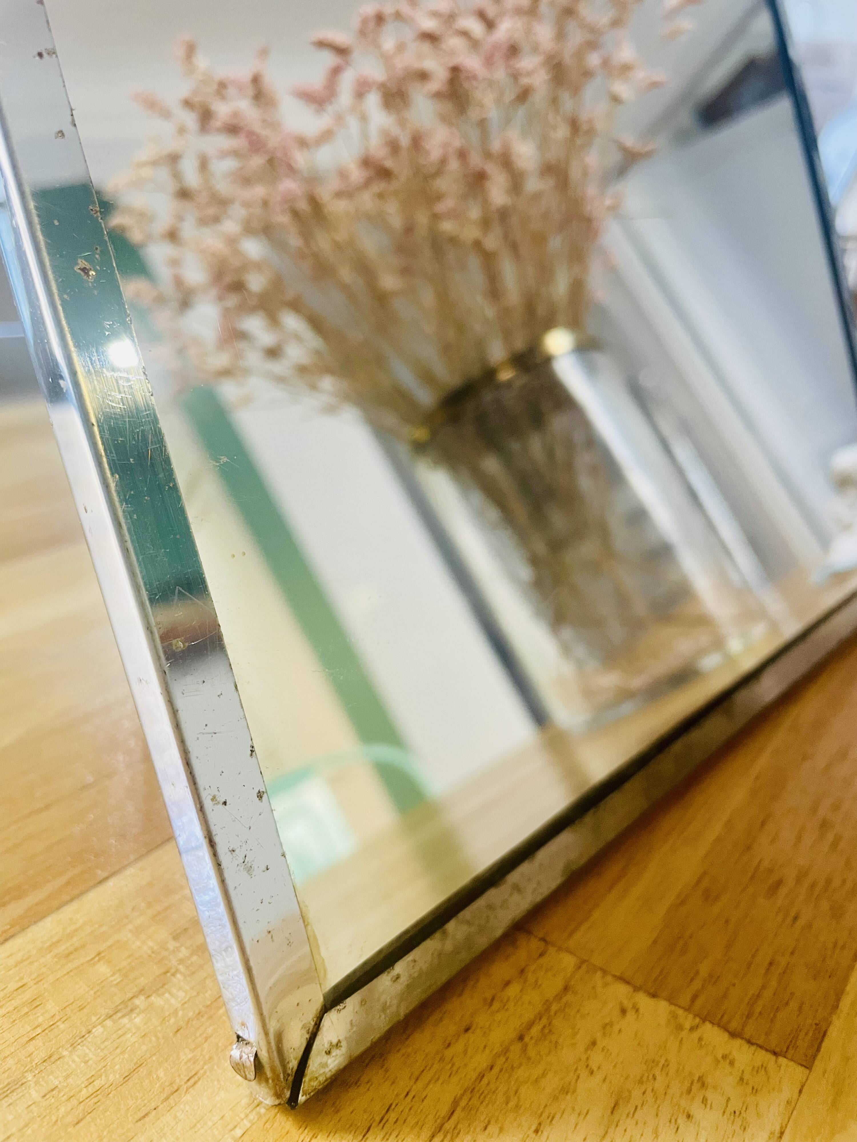 Barber mirror with chrome metal surround