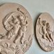 Pair of putti medallions