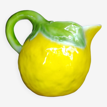 Old large ceramic pitcher with lemon slip