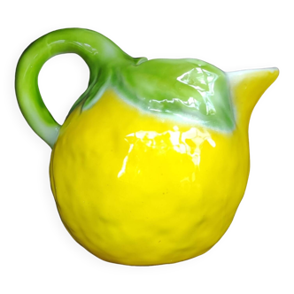 Old large ceramic pitcher with lemon slip