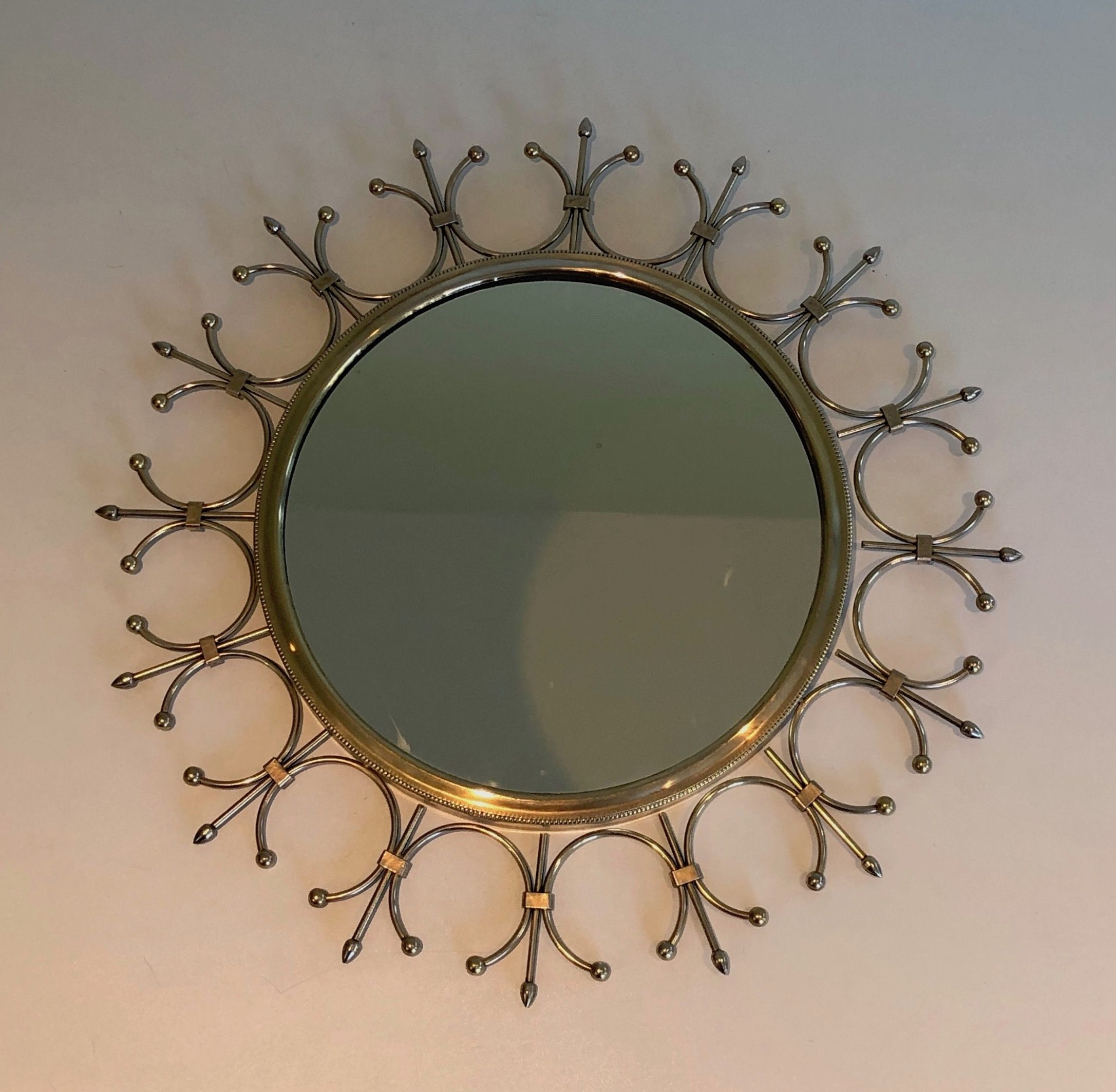 Sun mirror in brass and brushed steel