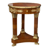 Circular gueridon empire of the 19th century in marquetry ornamented with gilt bronze