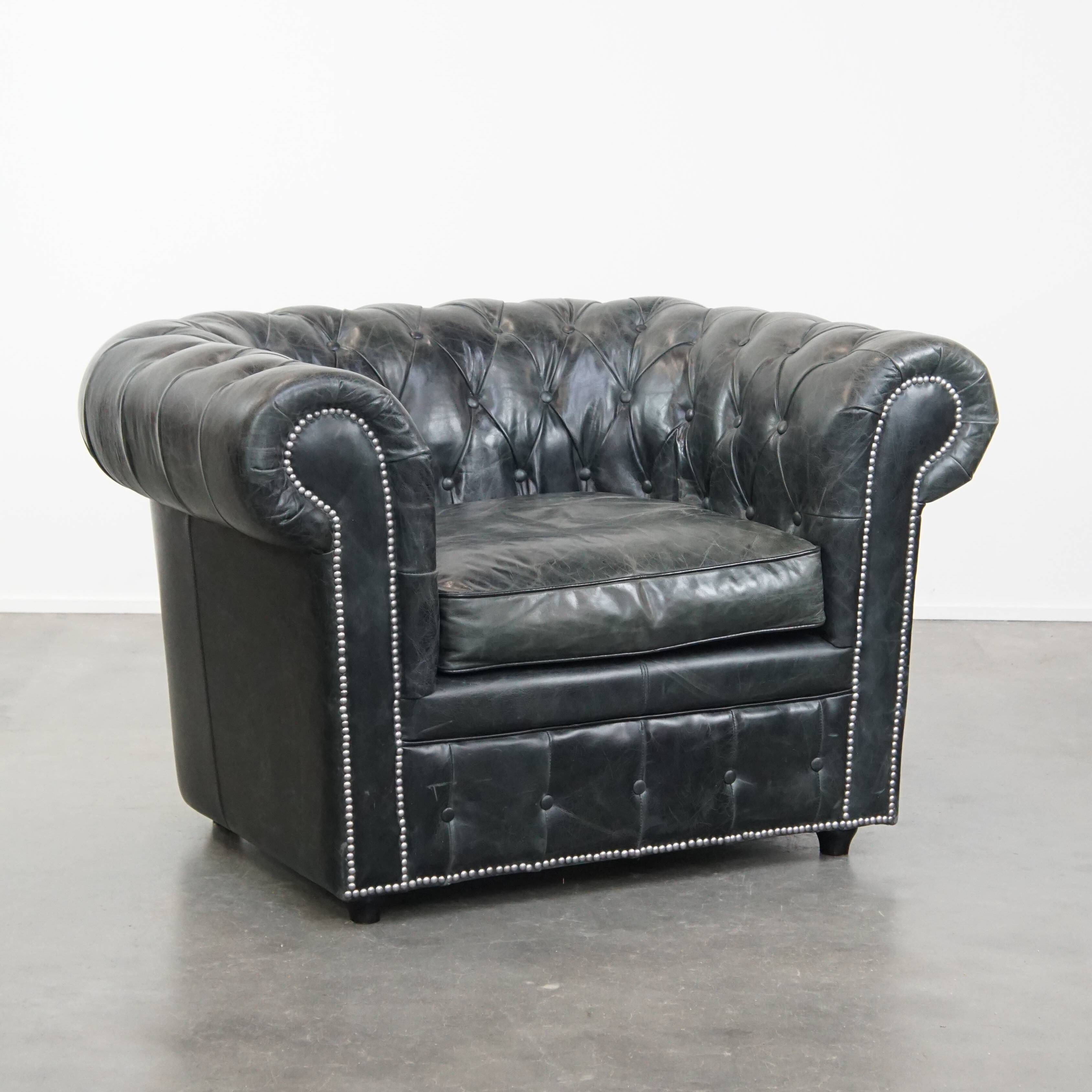 Black cowhide leather chesterfield armchair