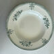 A deep plate in blue and green ironstone, antique French earthenware.
