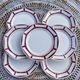 7 flat plates in white and red burgundy porcelain vintage Badonviller model Louise