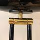 Black lacquered metal floor lamp with brass.
