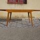 Extendable table, compass legs