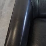 Very comfortable black Art Deco design armchair, made of sheepskin leather