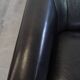 Very comfortable black Art Deco design armchair, made of sheepskin leather