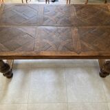 Old dining table with parquet floors