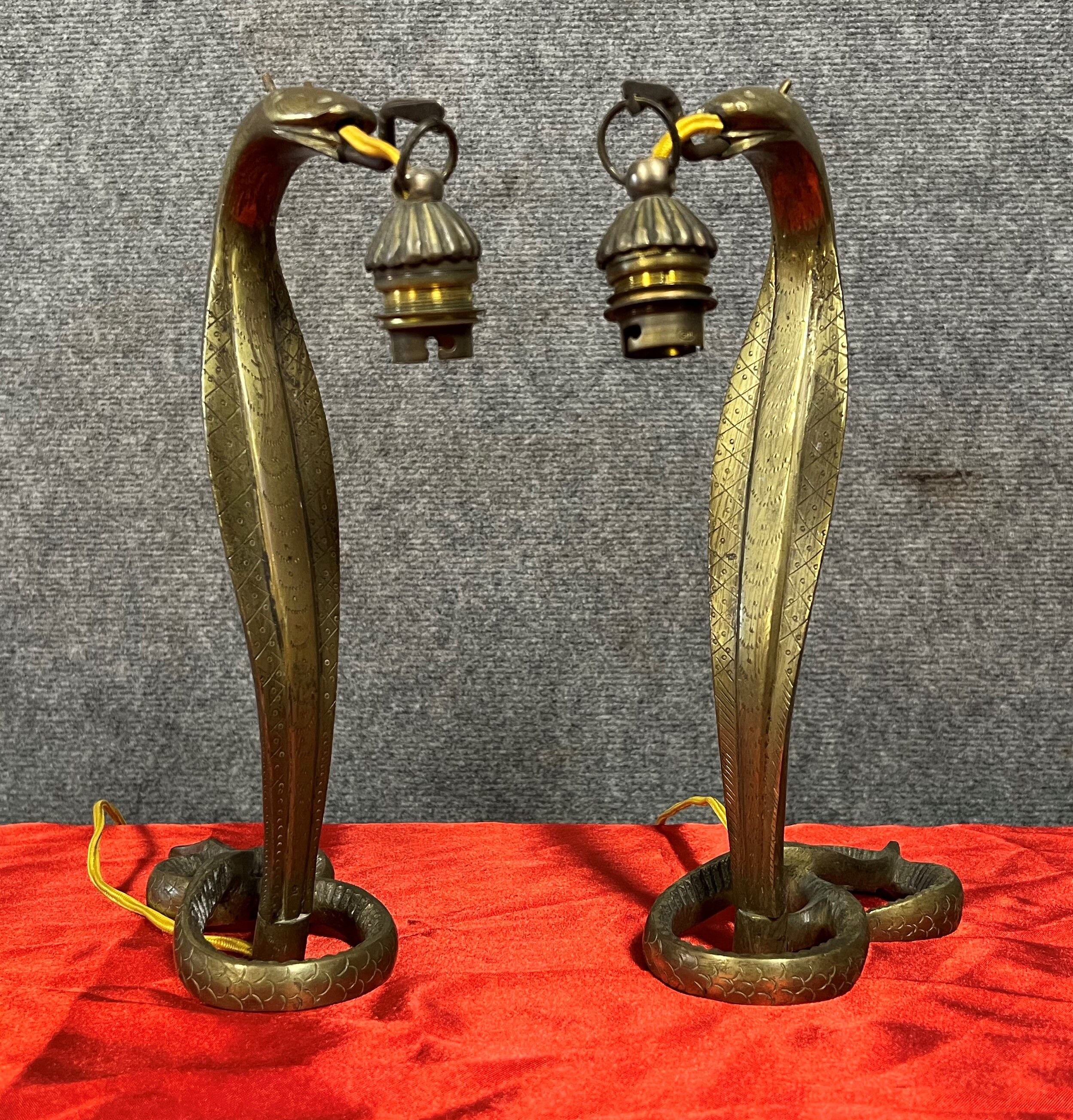 Pair of cobra lamps in gilded bronze