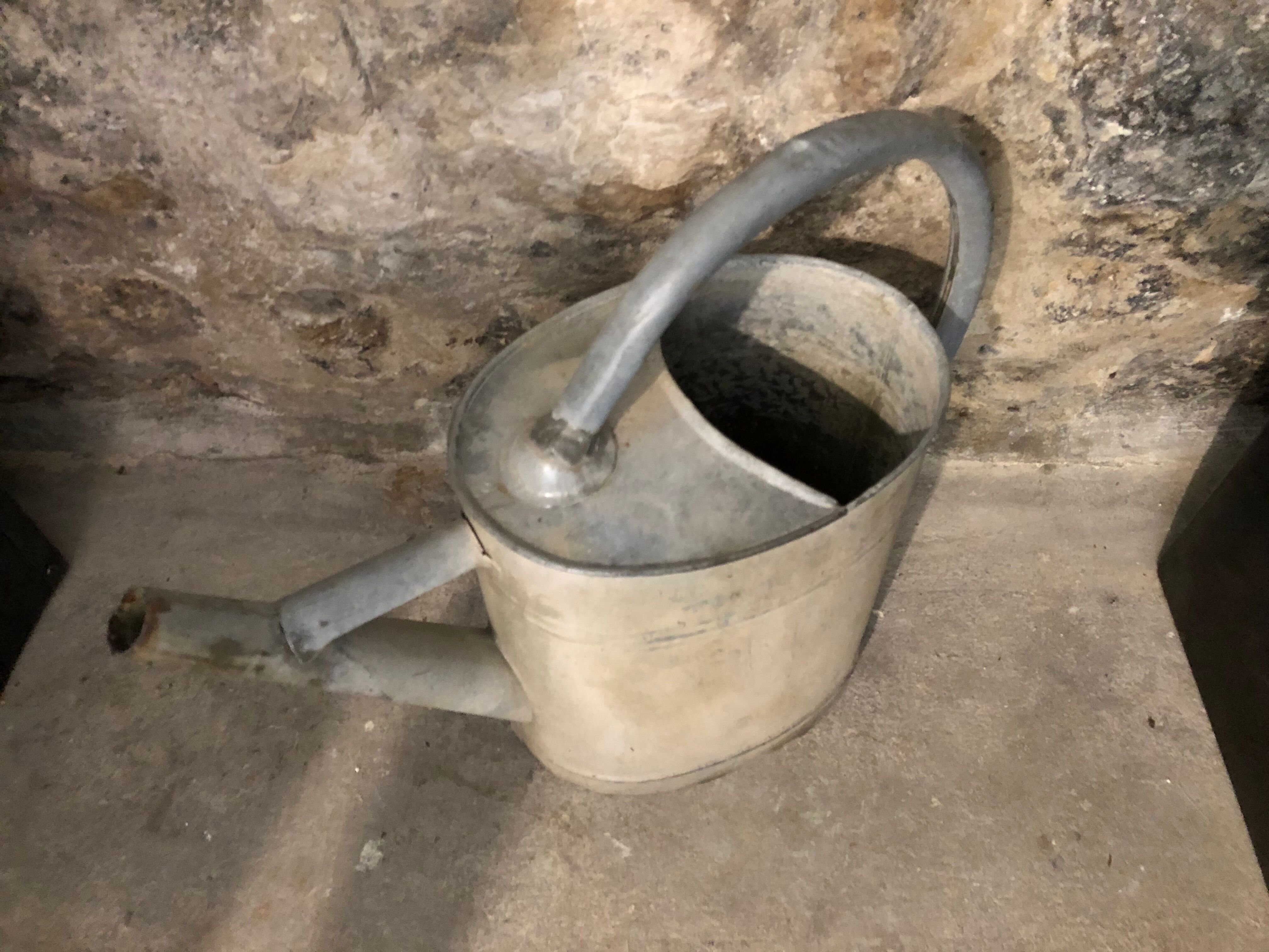 Old zinc watering can