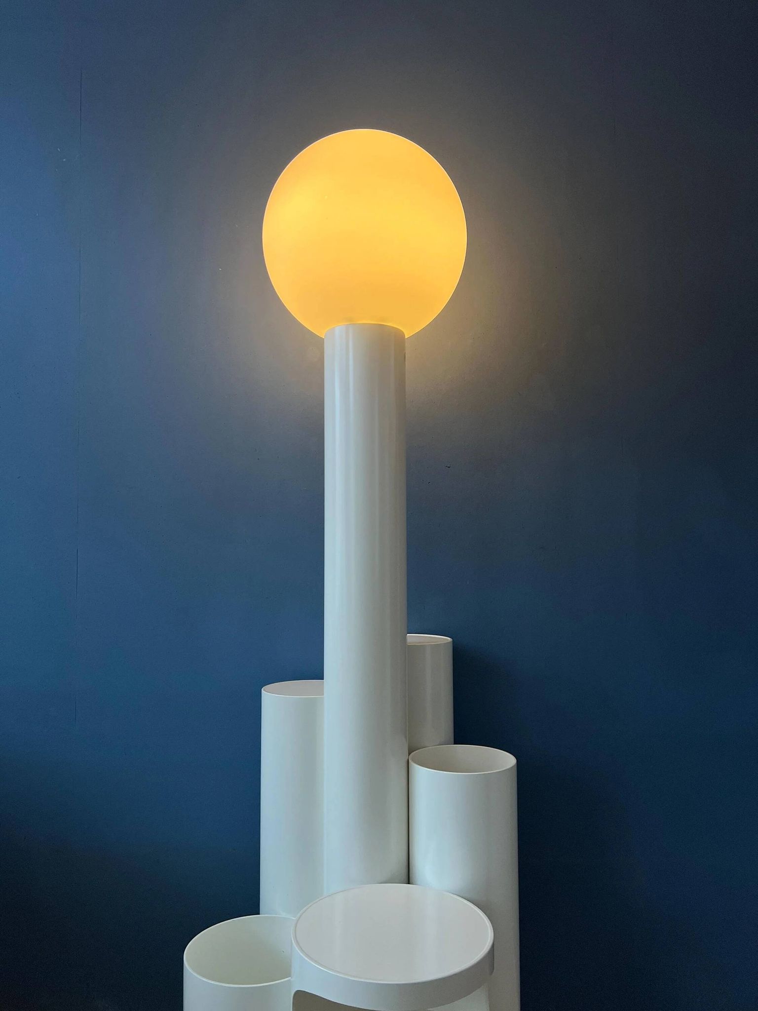 White floor lamp "Close Encounter" and plant stand by Kerst Koopman