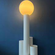 White floor lamp "Close Encounter" and plant stand by Kerst Koopman