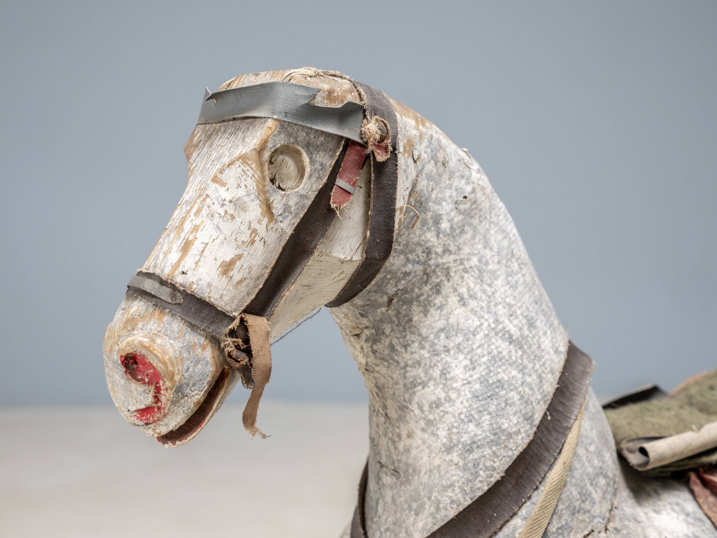 Antique wooden rocking horse, vintage toy with original patina.