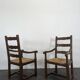 Paire de fauteuils rustiques en chêne assises paillées