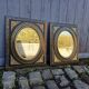Pair of antique mirrors from the Napoléon III period, black and gilded.