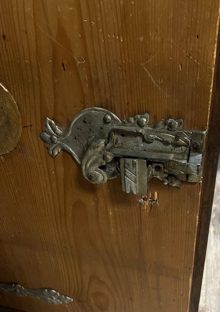 Ornamental piece of solid wood furniture, richly carved, dating from the 17th century.