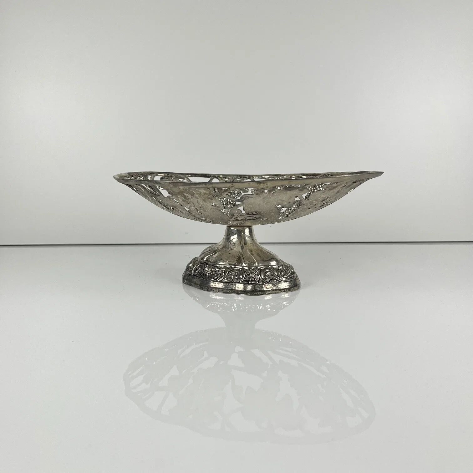 Openwork metal bowl with vine leaf and grape motif, 20th century