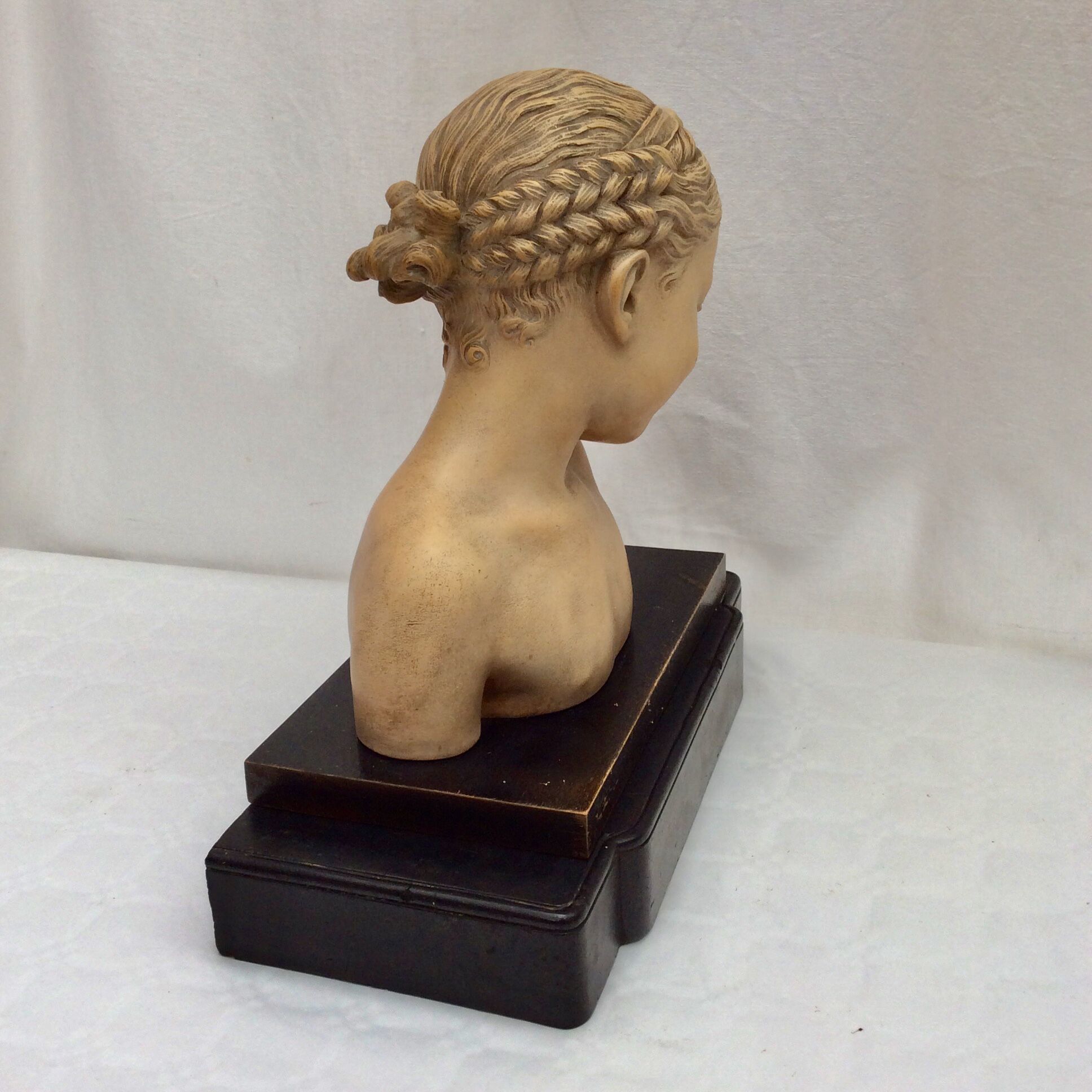 Girl's head in terracotta numbered