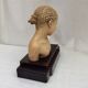 Girl's head in terracotta numbered