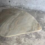 Light gray solid granite coffee table with organic triangular shape and conical base, 1980s