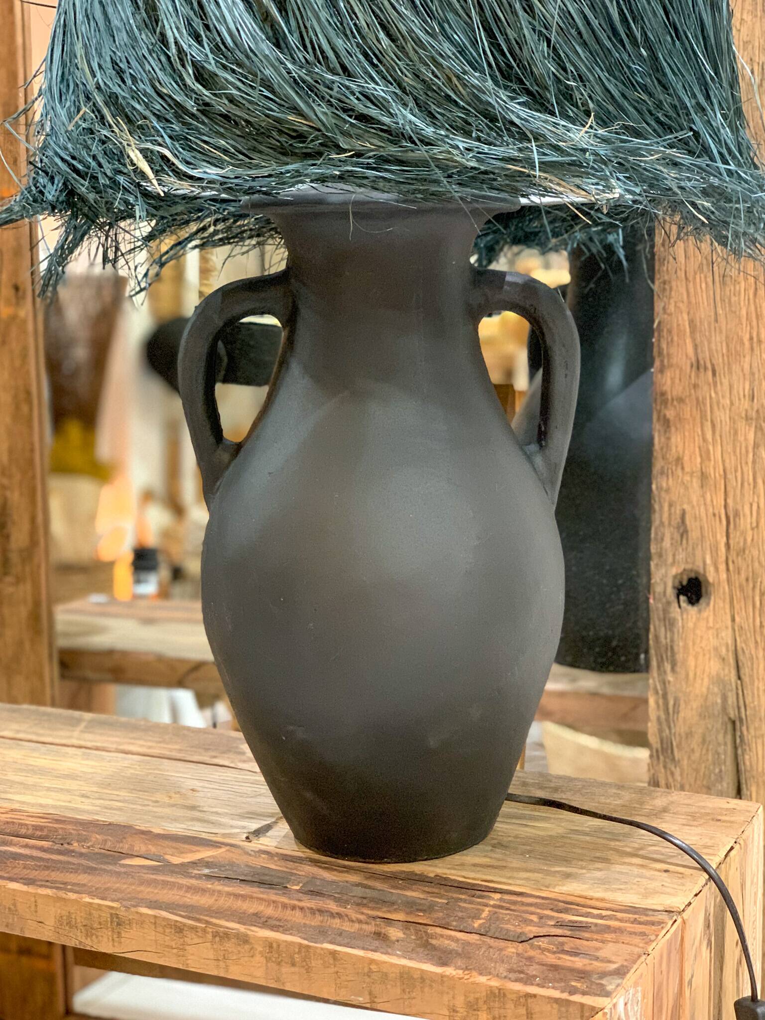 Black terracotta lamp and blue raffia lampshade
