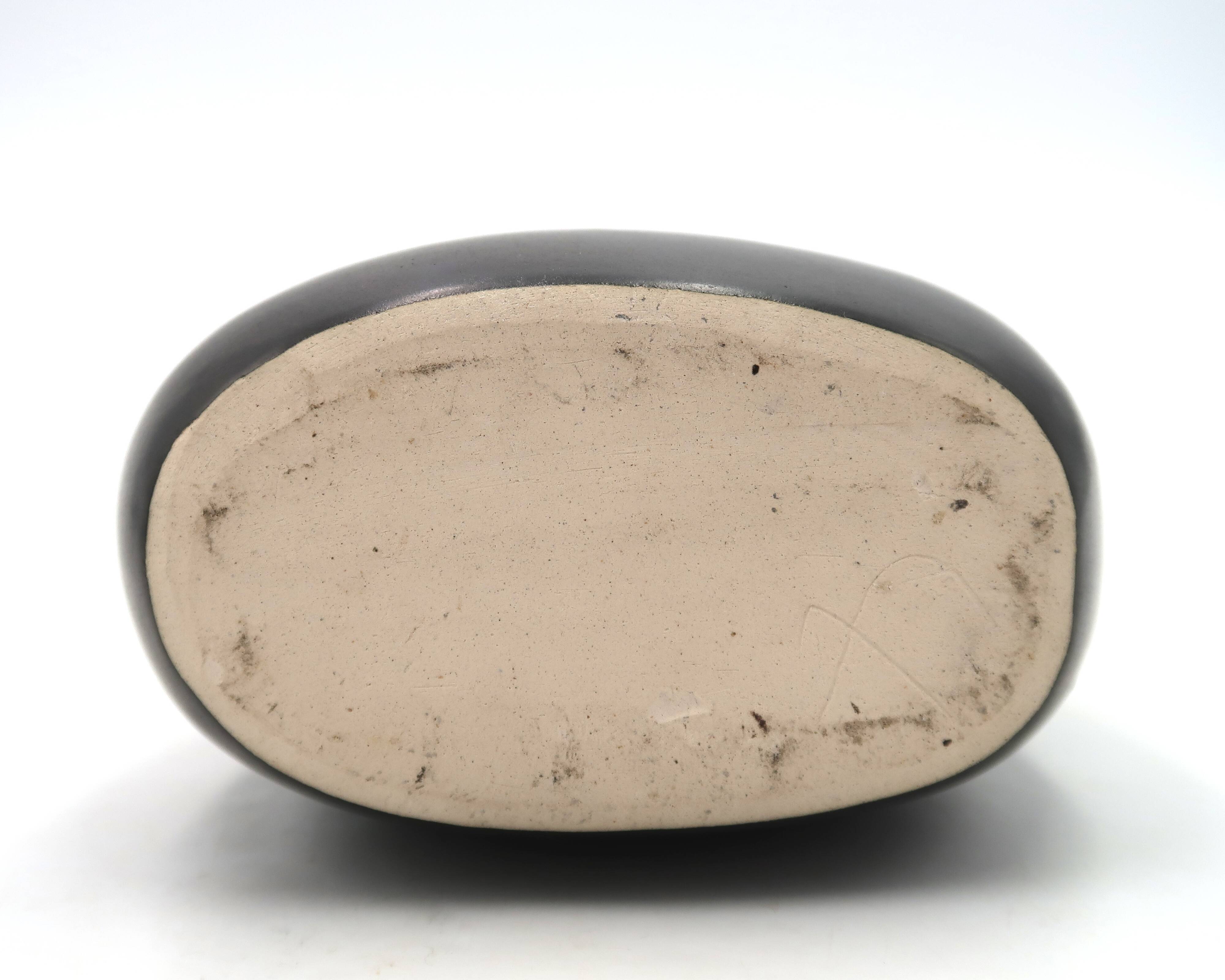 Free-form black signed candle holder, 1960s