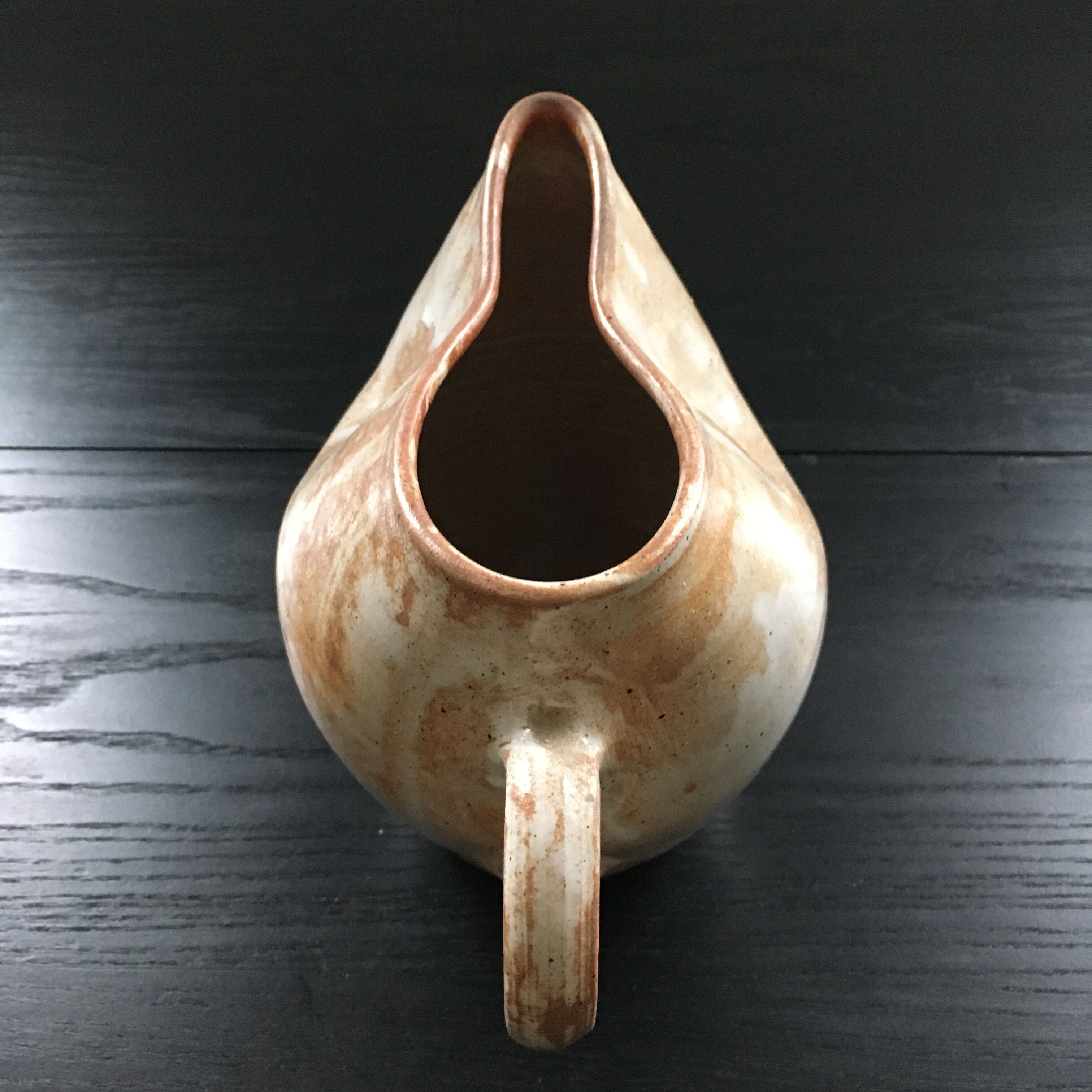Beige stoneware pitcher with white drips